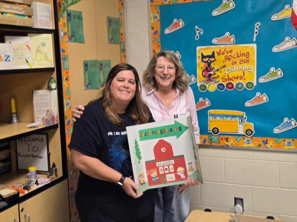 Presenting Miss Ogden her gift box of much needed supplies.